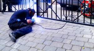 Guy Works On Gate